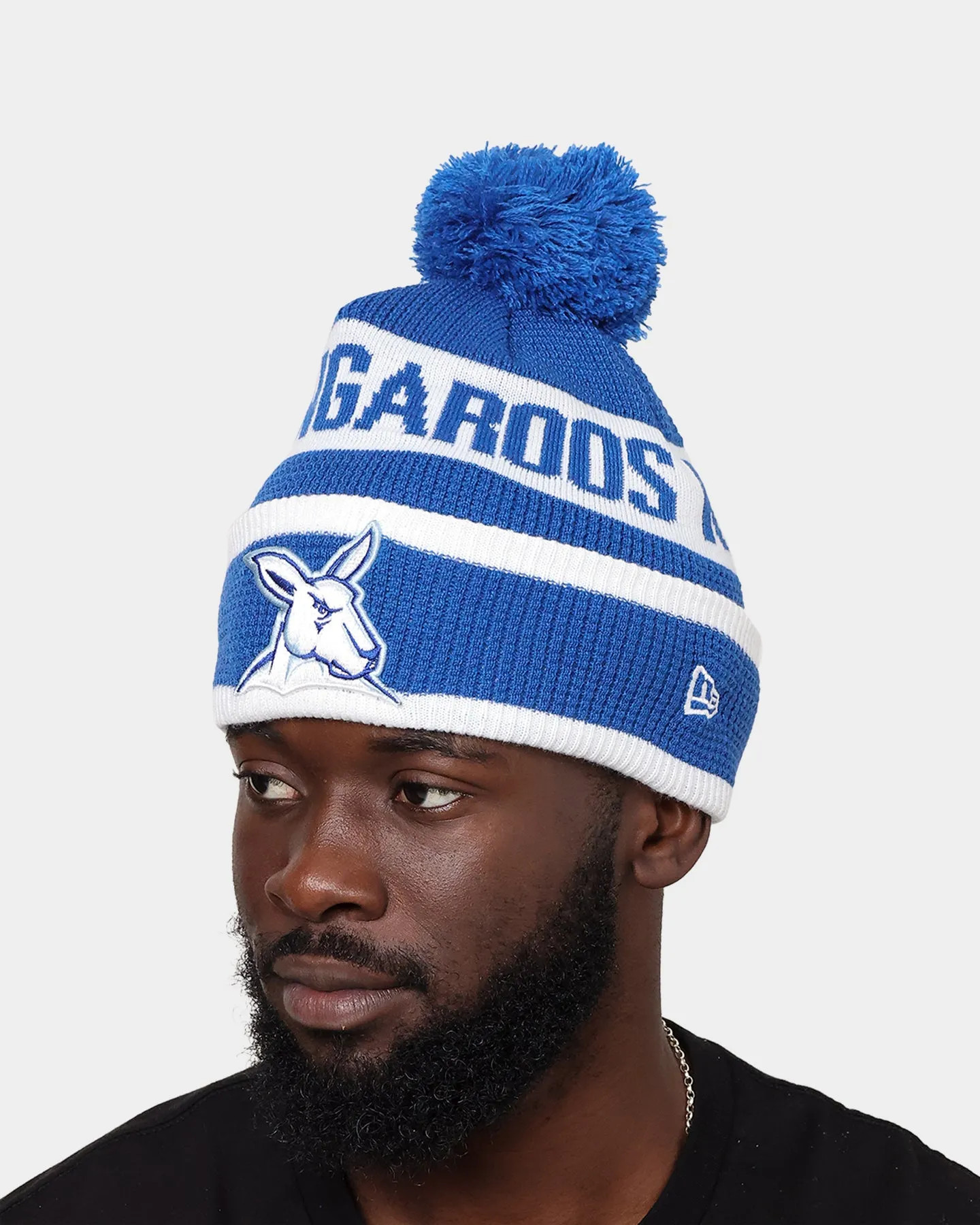 New Era North Melbourne Kangaroos AFL Opening Bounce 2022 Pom Waffle Wordmark Beanie Medium Blue