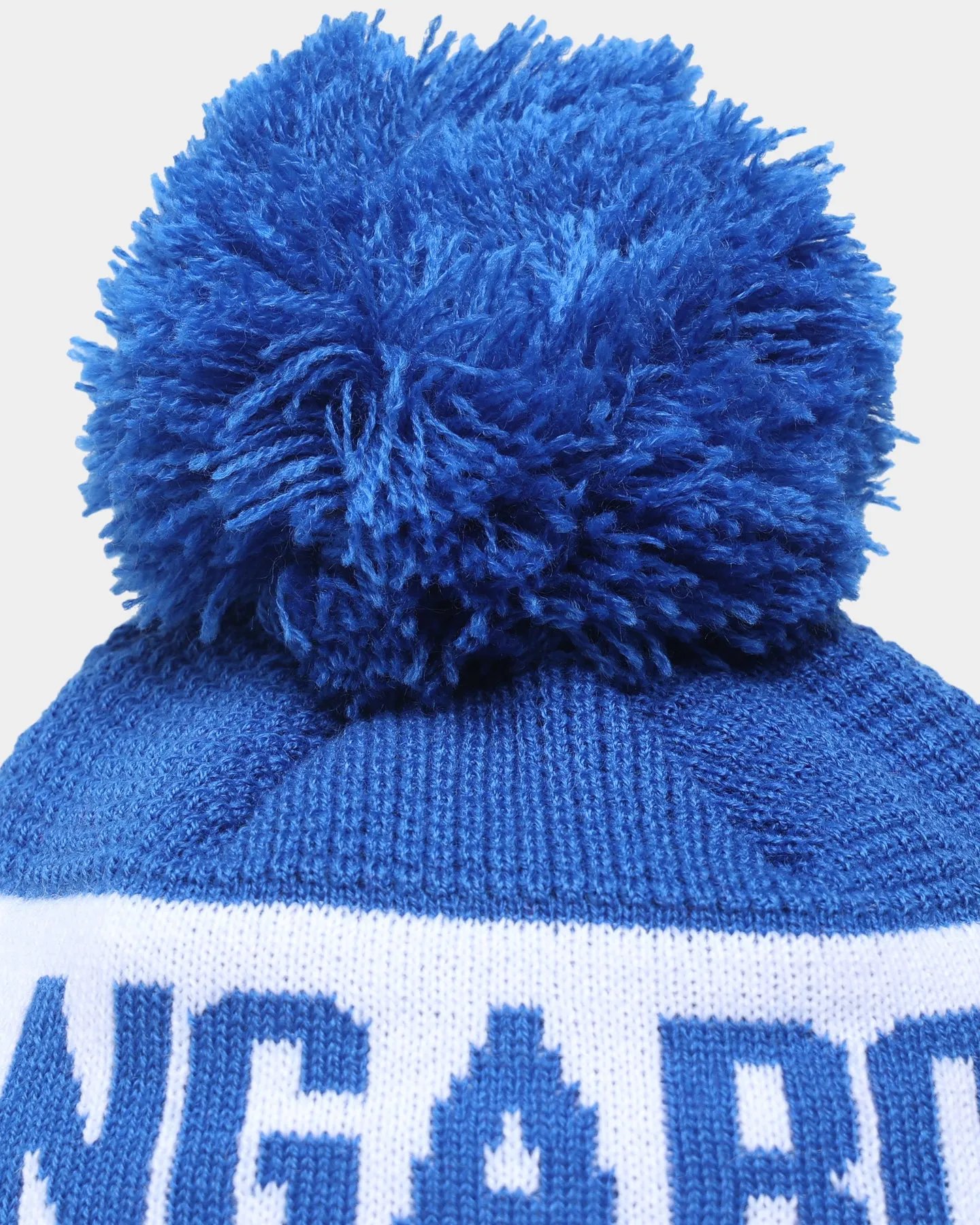 New Era North Melbourne Kangaroos AFL Opening Bounce 2022 Pom Waffle Wordmark Beanie Medium Blue